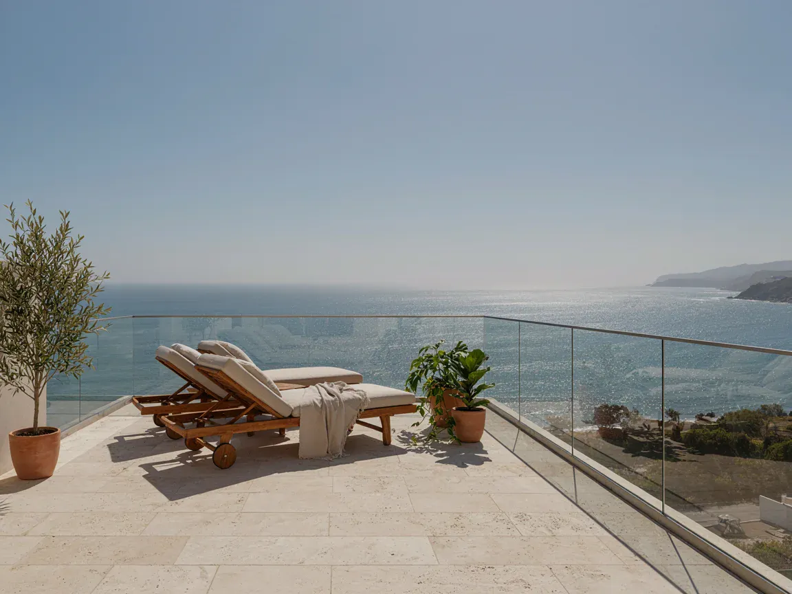 Terraza — Departamento con vista al mar (imagen generada, demostrativa)